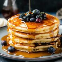 AI generated A stack of fluffy pancakes topped with blueberries and a drizzle of maple syrup photo