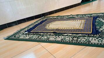 prayer mat on the carpet photo