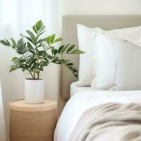 AI generated cozy bedroom with a small plant on the nightstand, adding a natural touch to the space. photo