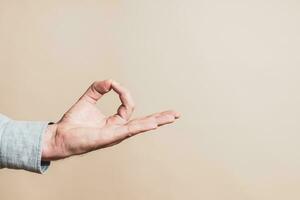 Close up image of  male hand meditating. photo