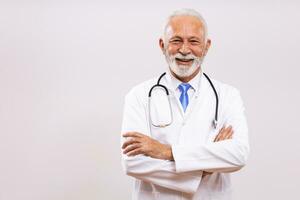 Portrait of senior doctor on gray background. photo