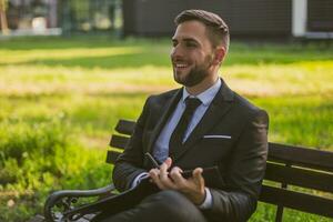 Elegant businessman working outdoor.Toned photo. photo