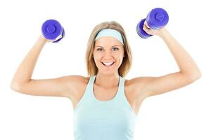 Sporty woman exercising with weights photo