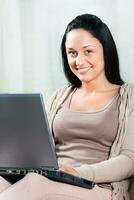 Young woman using laptop photo