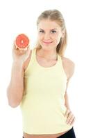 Sporty woman holding grapefruit photo