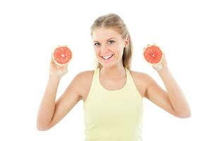 Sporty woman holding grapefruit photo