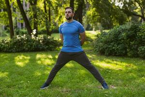 Handsome man practicing  in the park. photo