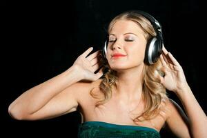 Happy girl with headphones photo