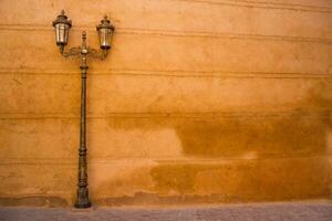 Image of old wall and street lamp in Morocco. photo