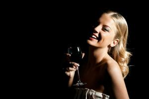 Elegant woman with glass of  wine photo