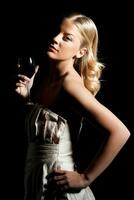 Elegant woman with glass of  wine photo