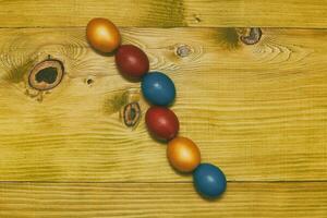 Painted Easter eggs  on wooden table.Toned photo. photo