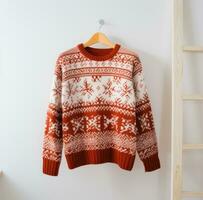 AI generated an old sweater with snowflake patterns hanging on a white wall. photo