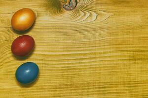 Painted Easter eggs  on wooden table.Toned photo. photo