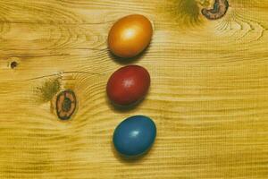 Painted Easter eggs  on wooden table.Toned photo. photo