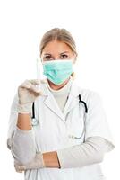 Doctor with protective mask and syringe photo