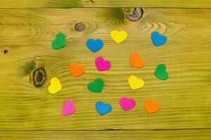 Image of little heart shapes on wooden table.Toned photo. photo