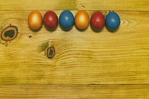 Painted Easter eggs  on wooden table.Toned photo. photo