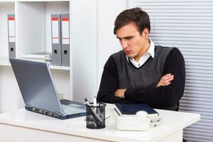 Angry businessman working photo