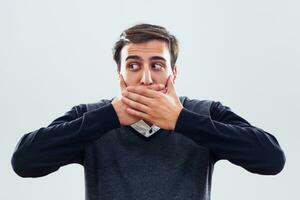 Businessman covering his mouth photo