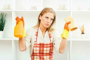 Exhausted housewife cleaning photo