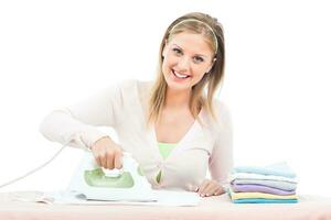 Happy housewife  ironing photo