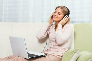 Woman with headphones listening music photo