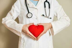 Image of female doctor showing heart . photo