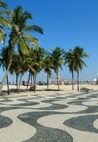 Famous sidewalk with mosaic of Copacabana and Leme beach in Rio de Janeiro Brazil photo
