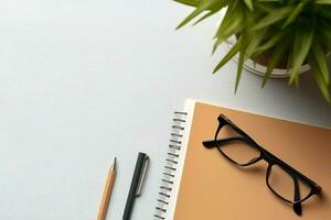 AI generated Office stationery with glasses and plant on white desk, flat lay, top view photo