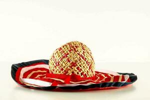 a straw hat with red, white and blue stripes photo