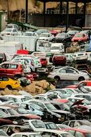 a large lot of cars are parked in a parking lot photo