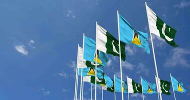 Pakistan and Saint Lucia Flags Waving Together in the Sky, Seamless Loop in Wind, Space on Left Side for Design or Information, 3D Rendering video