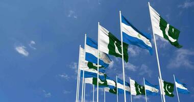 Pakistan and Nicaragua Flags Waving Together in the Sky, Seamless Loop in Wind, Space on Left Side for Design or Information, 3D Rendering video