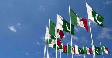 Pakistan and Mexico Flags Waving Together in the Sky, Seamless Loop in Wind, Space on Left Side for Design or Information, 3D Rendering video