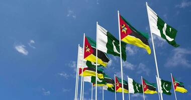 Pakistan and Mozambique Flags Waving Together in the Sky, Seamless Loop in Wind, Space on Left Side for Design or Information, 3D Rendering video