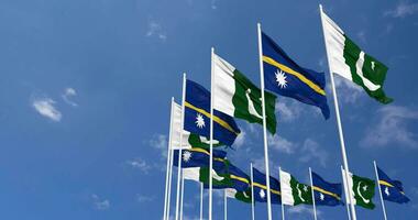 Pakistan and Nauru Flags Waving Together in the Sky, Seamless Loop in Wind, Space on Left Side for Design or Information, 3D Rendering video