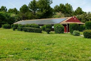 a house with solar panels on the roof photo