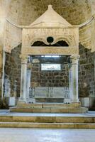 the tomb of person in the church of the holy sepulchre in jerusalem photo