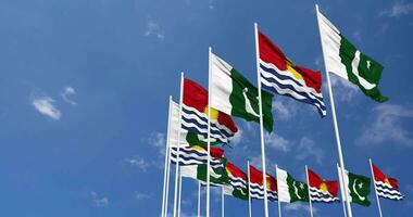 Pakistan and Kiribati Flags Waving Together in the Sky, Seamless Loop in Wind, Space on Left Side for Design or Information, 3D Rendering video