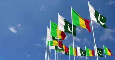 Pakistan and Mali Flags Waving Together in the Sky, Seamless Loop in Wind, Space on Left Side for Design or Information, 3D Rendering video