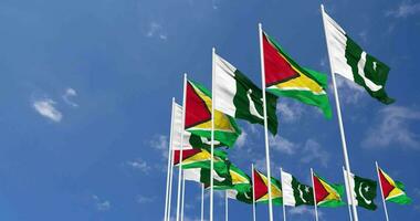 Pakistan and Guyana Flags Waving Together in the Sky, Seamless Loop in Wind, Space on Left Side for Design or Information, 3D Rendering video