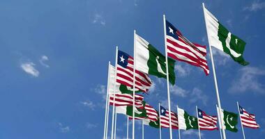 Pakistan and Liberia Flags Waving Together in the Sky, Seamless Loop in Wind, Space on Left Side for Design or Information, 3D Rendering video
