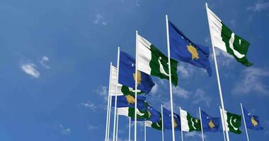 pakistan och kosovo flaggor vinka tillsammans i de himmel, sömlös slinga i vind, Plats på vänster sida för design eller information, 3d tolkning video