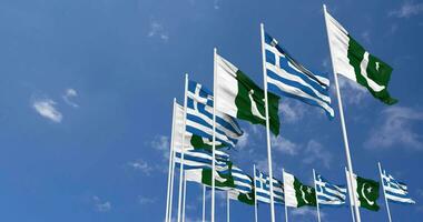 Pakistan and Greece Flags Waving Together in the Sky, Seamless Loop in Wind, Space on Left Side for Design or Information, 3D Rendering video