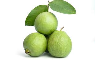 Organic guava fruit with stems and leaves, bright green skin, pink guava flesh, with leaves isolated on white background. photo