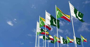 Pakistan and Comoros Flags Waving Together in the Sky, Seamless Loop in Wind, Space on Left Side for Design or Information, 3D Rendering video