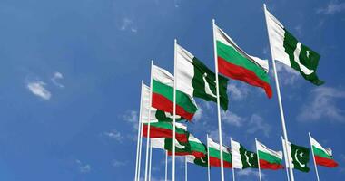 Pakistan and Bulgaria Flags Waving Together in the Sky, Seamless Loop in Wind, Space on Left Side for Design or Information, 3D Rendering video