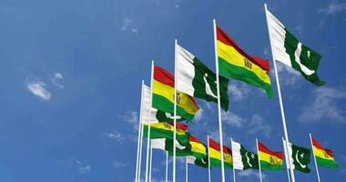 Pakistan and Bolivia Flags Waving Together in the Sky, Seamless Loop in Wind, Space on Left Side for Design or Information, 3D Rendering video