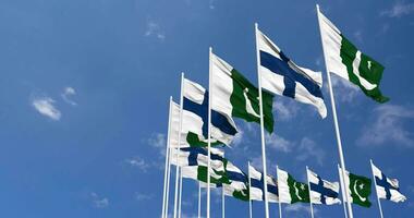 Pakistan and Finland Flags Waving Together in the Sky, Seamless Loop in Wind, Space on Left Side for Design or Information, 3D Rendering video